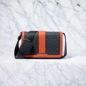 Michael Kors Black and Orange Crossbody Bag with Modern Flair